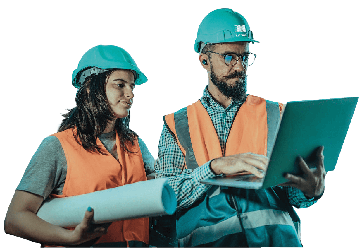 Klarwin engineers with teal hard hats and orange vests
