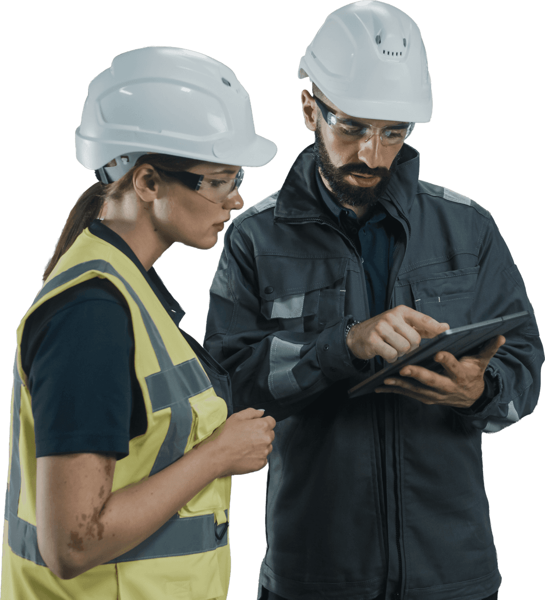 Industrial engineers reviewing production data on tablet