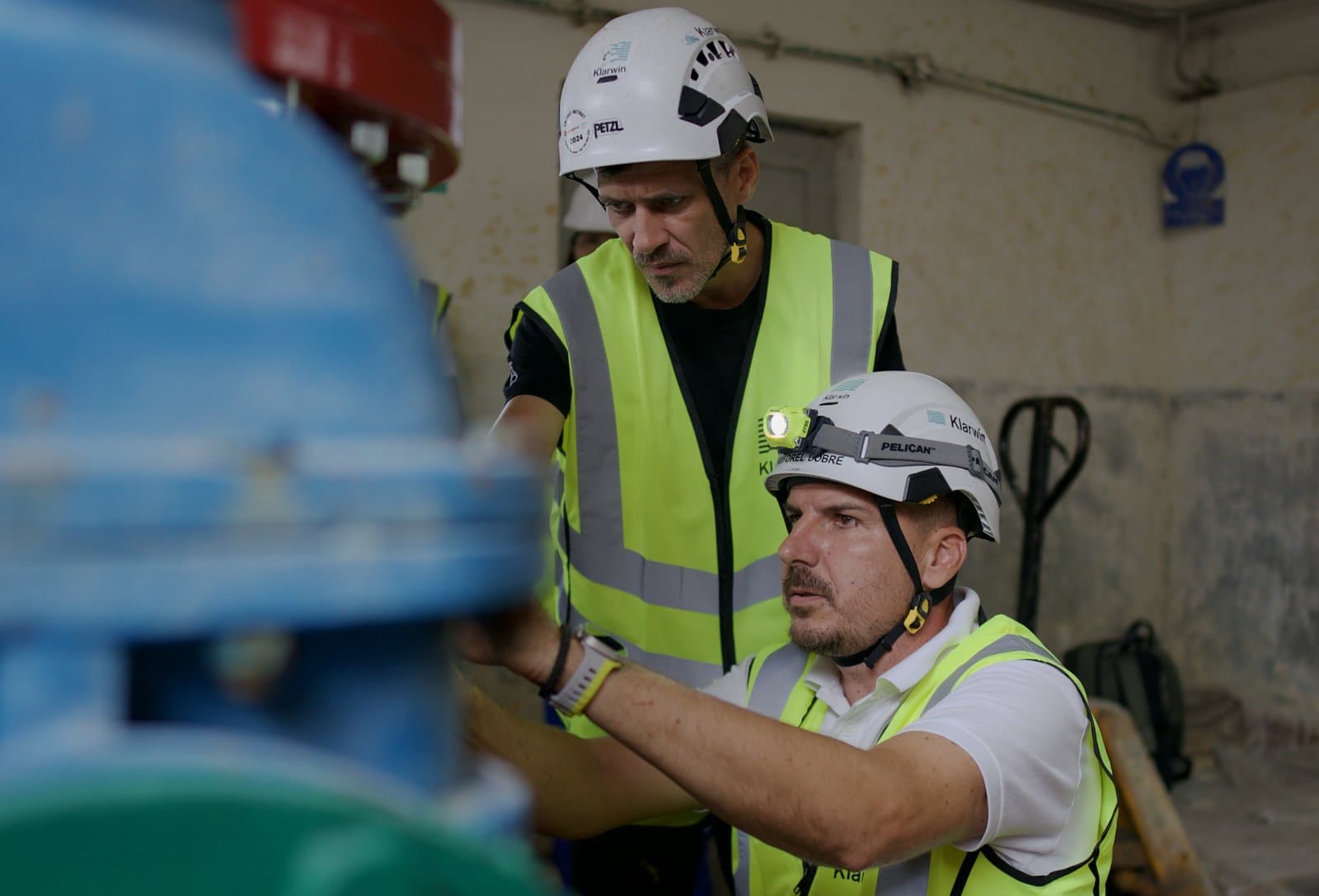 Two Klarwin field engineers inspecting a valve before an industrial flushing run