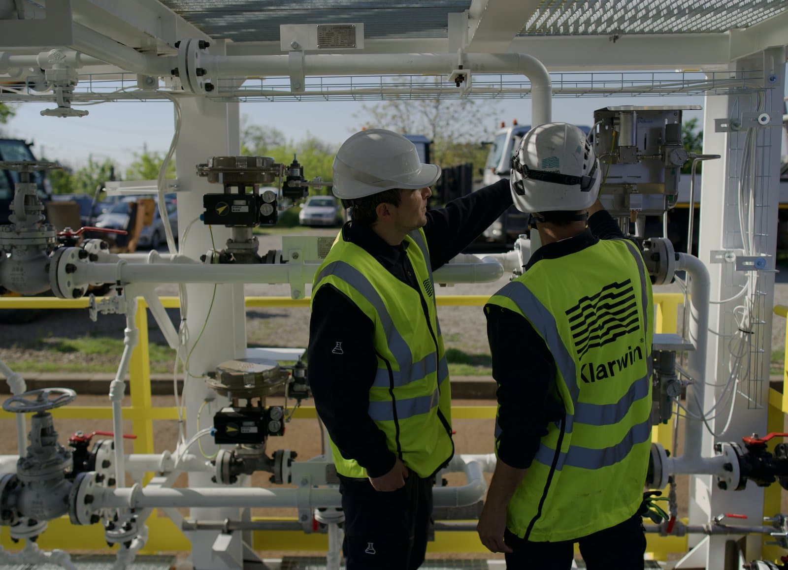Klarwin engineers conducting on-site technical training at an industrial process skid