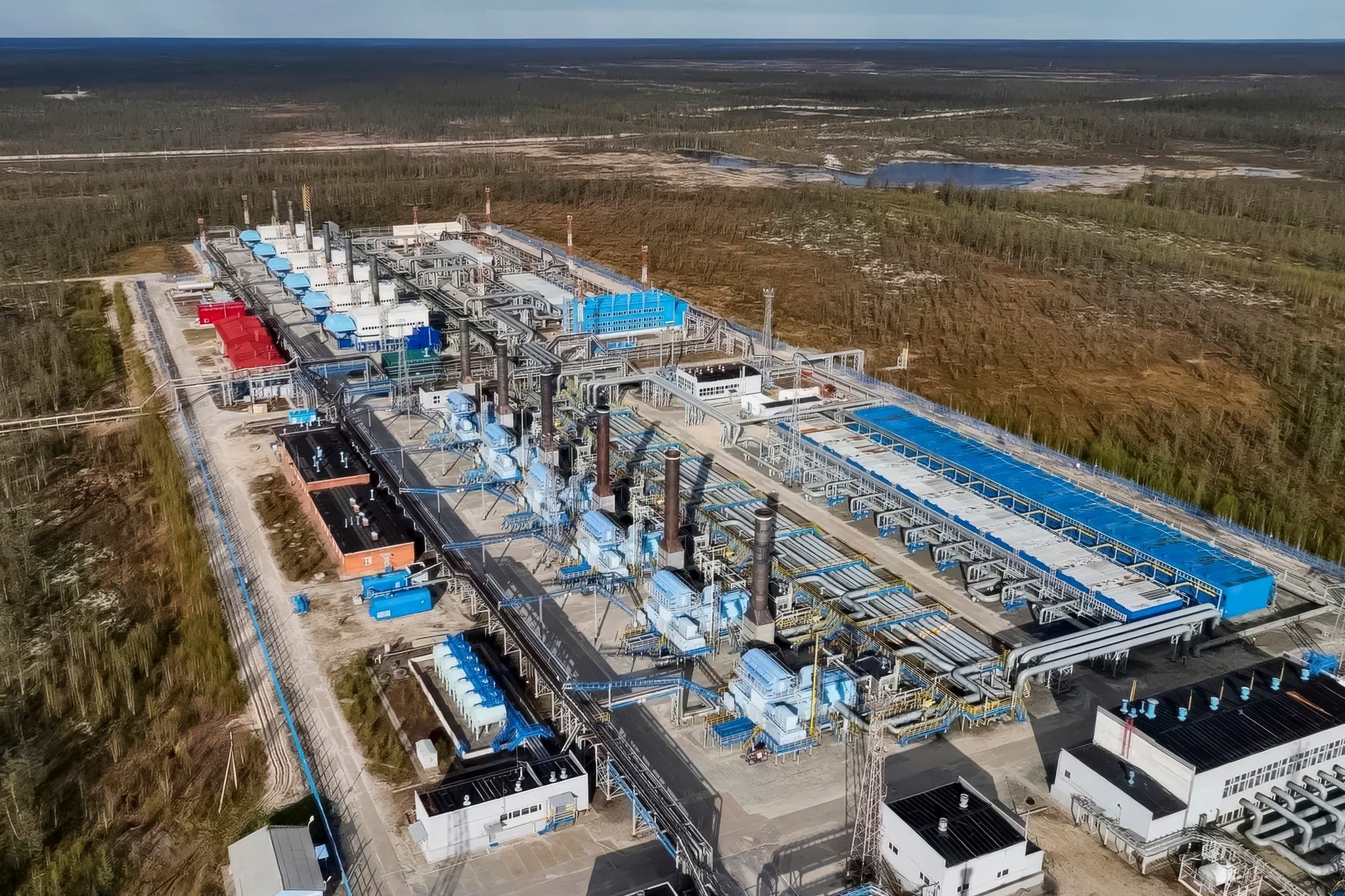 Aerial view of an upstream gas processing facility in remote terrain