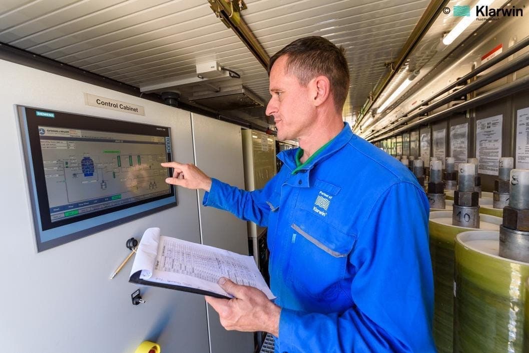 Klarwin service technicians performing diagnostics and maintenance on treatment installation