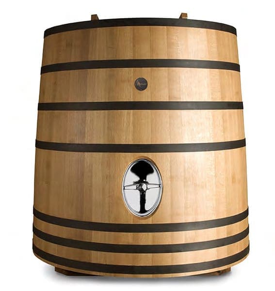 Large oak wine barrels in cellar — slow micro-oxygenation maturation