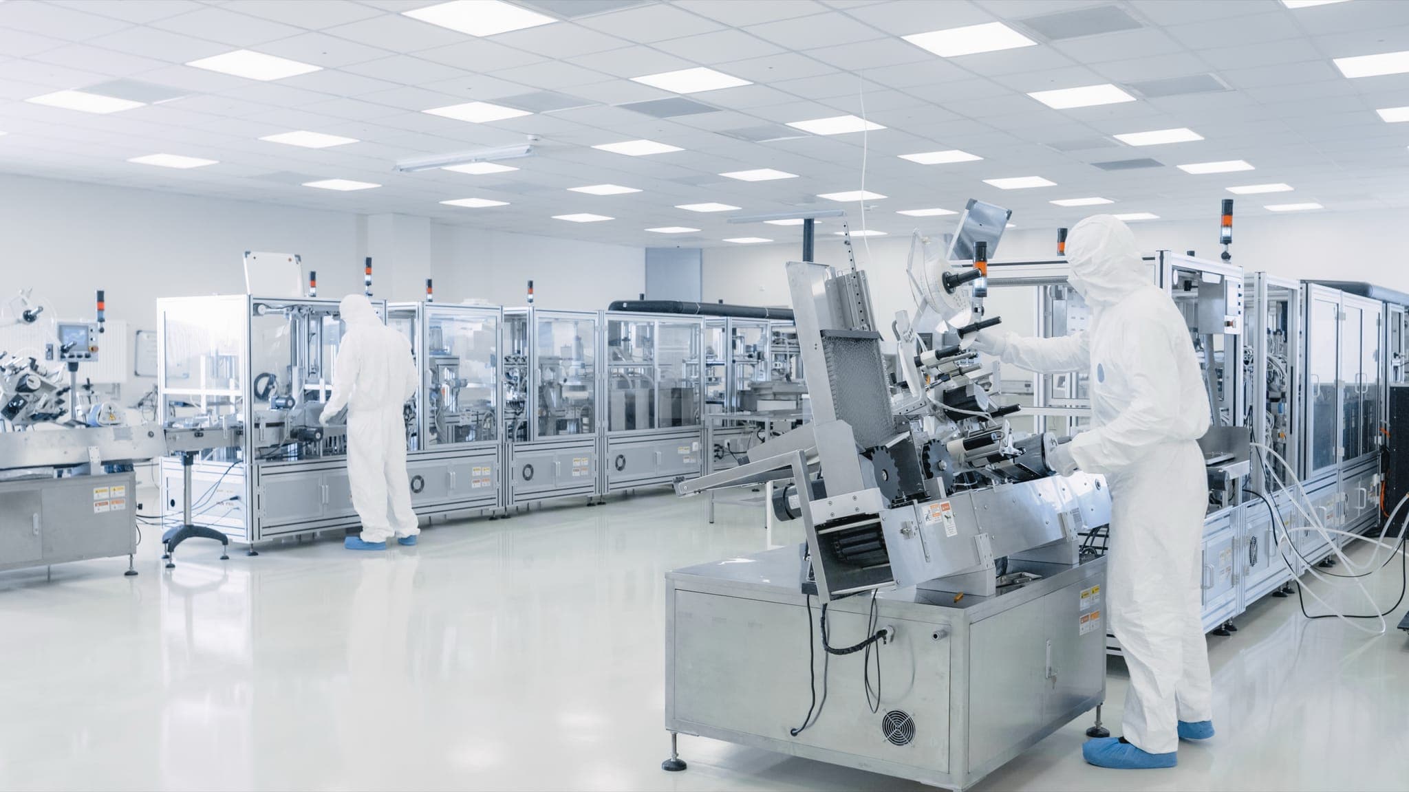 Pharmaceutical laboratory with controlled environment for sterile fluid processing