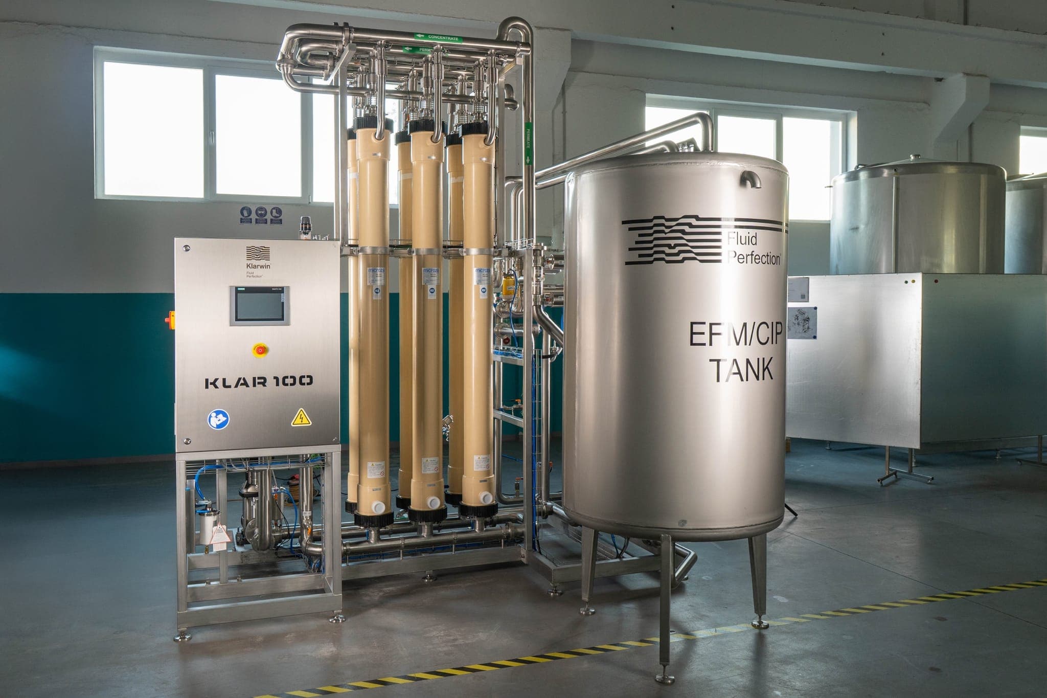 Klar100 UF installation — Microza modules, KLAR100 control cabinet and EFM/CIP tank, custom-built for client process
