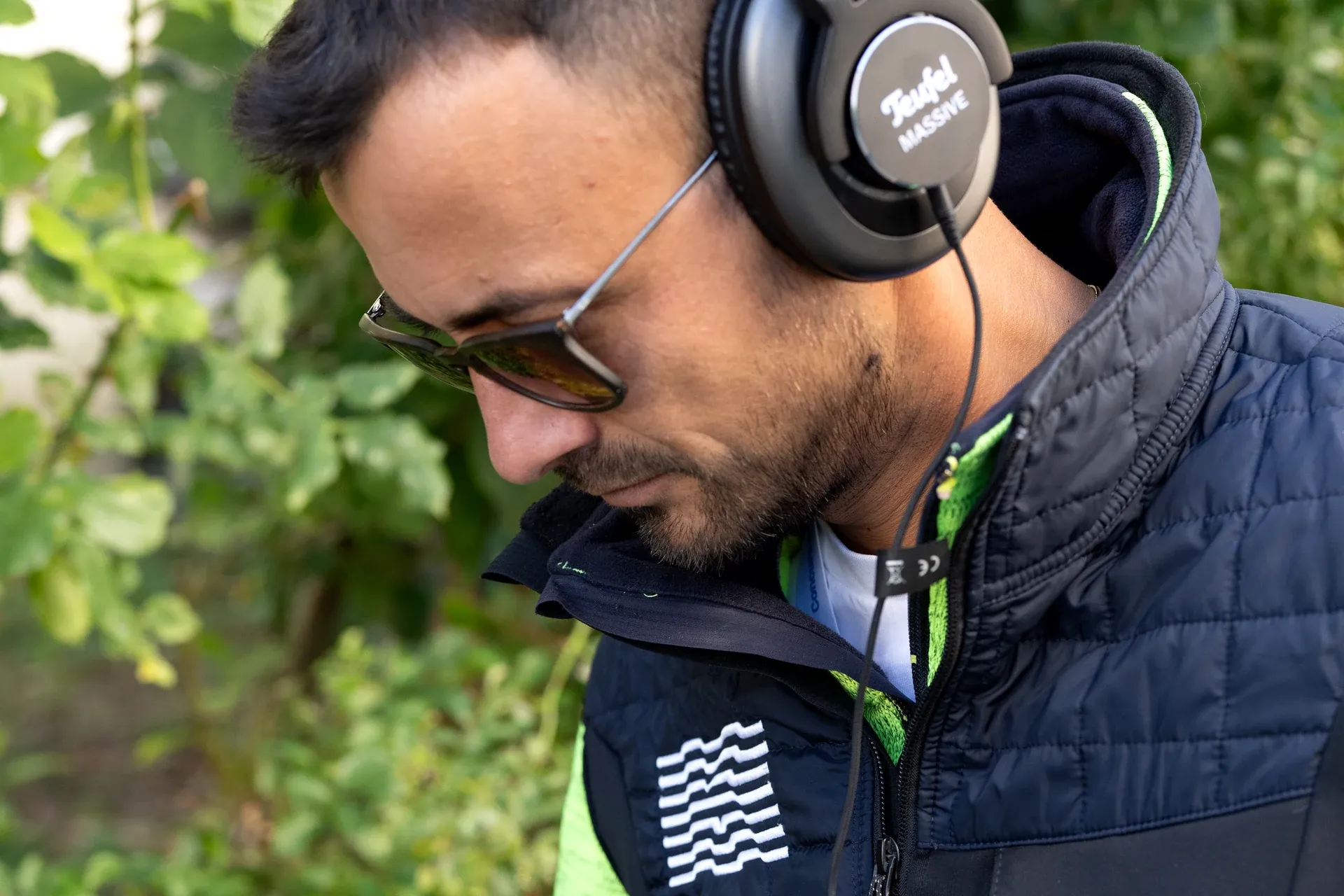 An operator listening on headphones for the sound of a leak