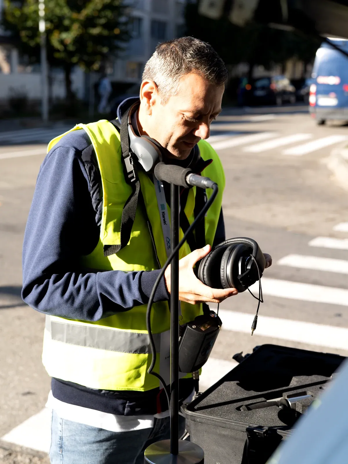 An operator checking his headphones before setting out on the route