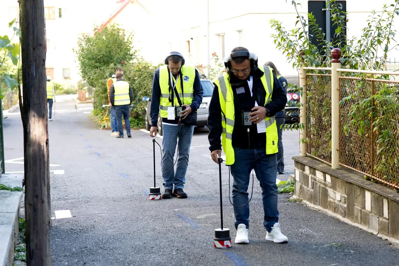 Two operators walking one of the four routes with ground microphones