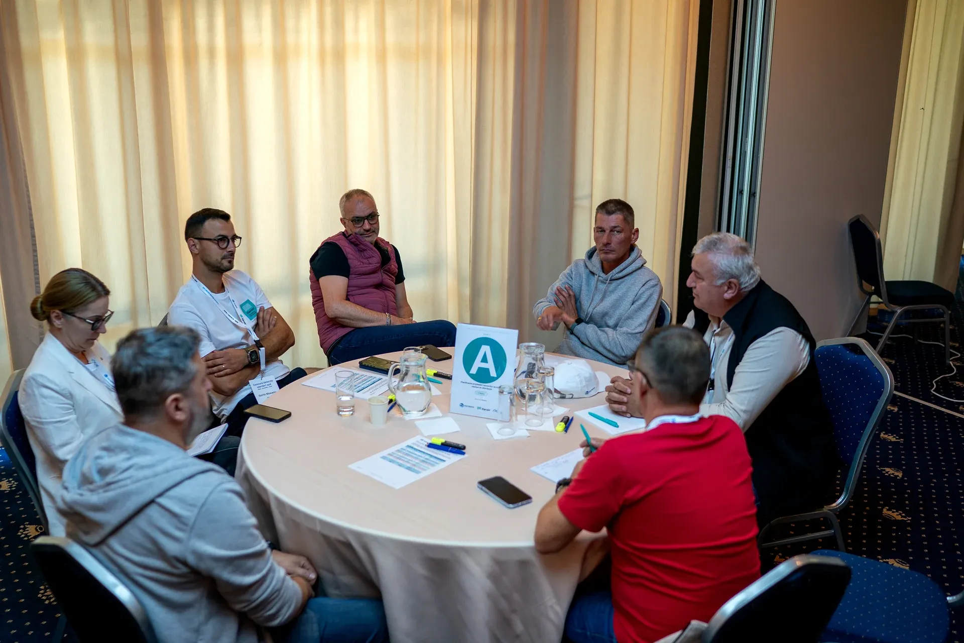Specialists in discussion around one of the five round tables
