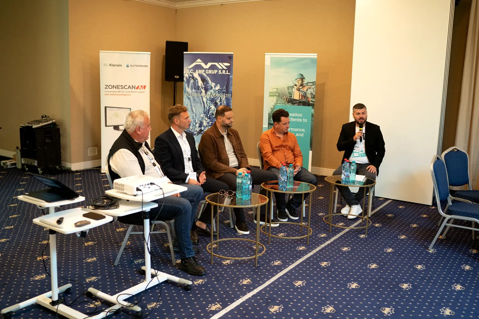 The closing panel, with the organisers and technology partners